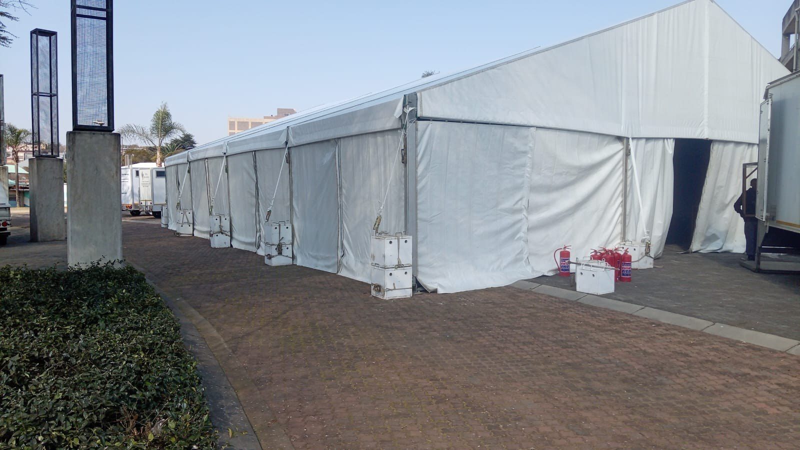 Fire extinguishers stationed inside a marquee